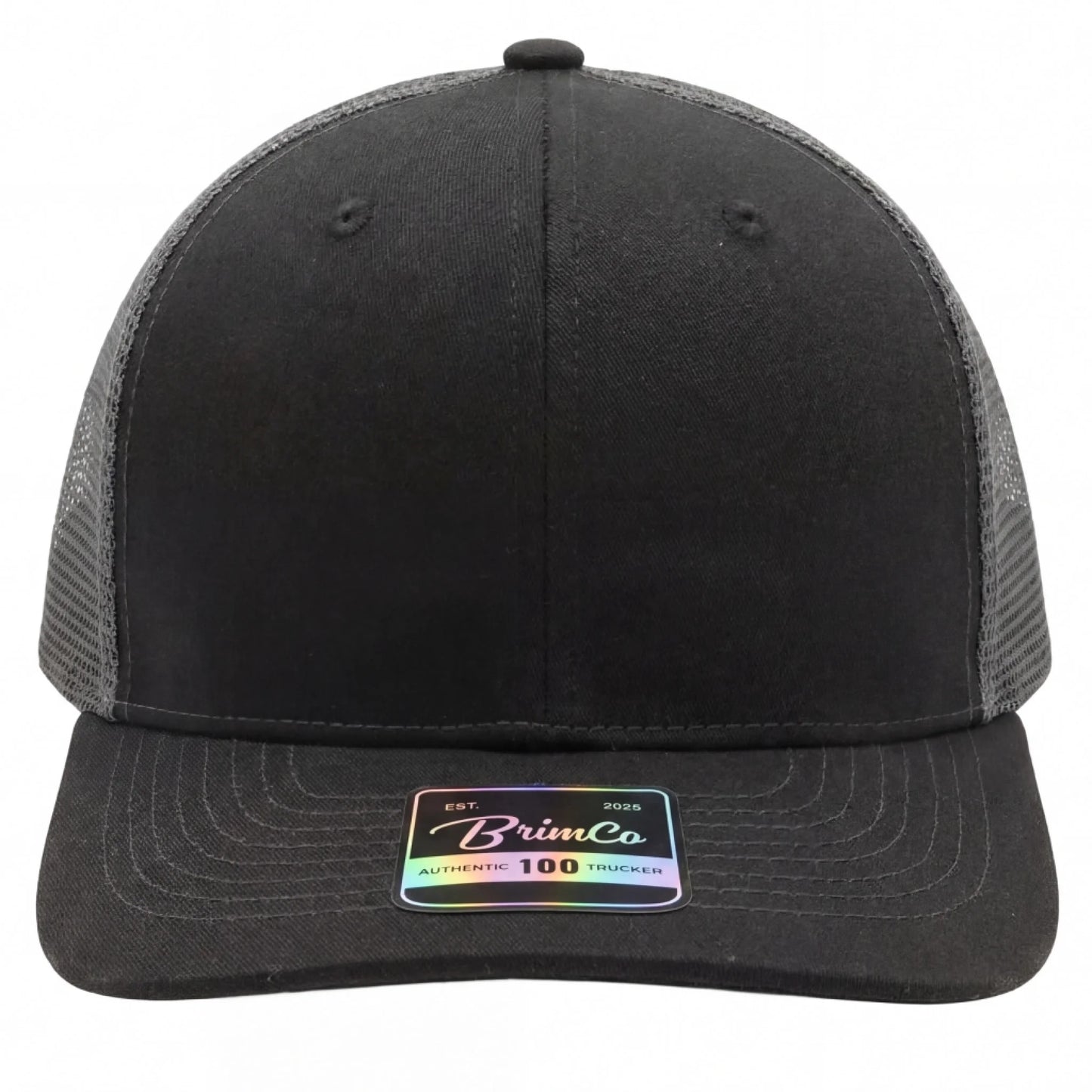 Black Brimco 100 trucker hat with a structured front panel and charcoal mesh back, designed for breathable comfort, lightweight wear, and durable everyday casual or active use.